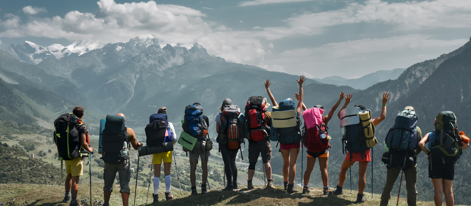 Group of hikers at mountain campsite